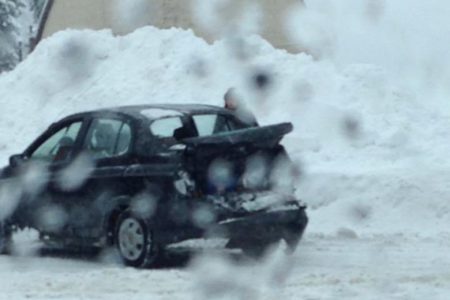 Man injured after vehicle struck by snow plow