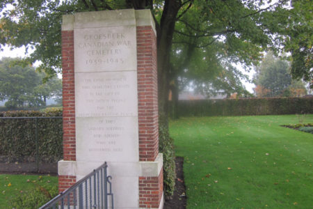 Former Nelsonite views graves of three local soldiers at Groesbeek Canadian War Cemetery