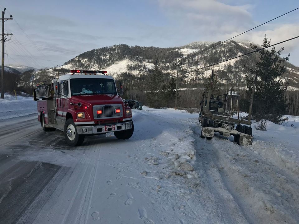 Sliding semi barely misses firefighters attending MVI