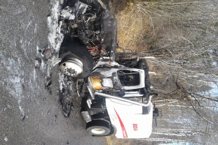 Trail street sweeper catches fire