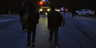 Dark mornings mean extra care on the walk to school